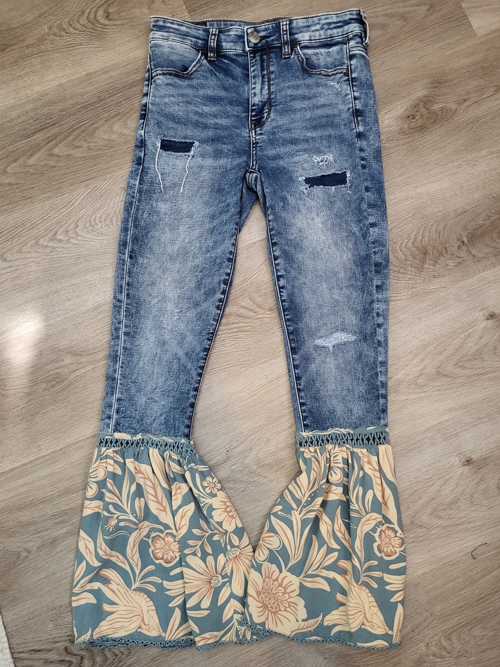 Women’s Blue Distressed Bell Bottom Jeans with Floral Flounce